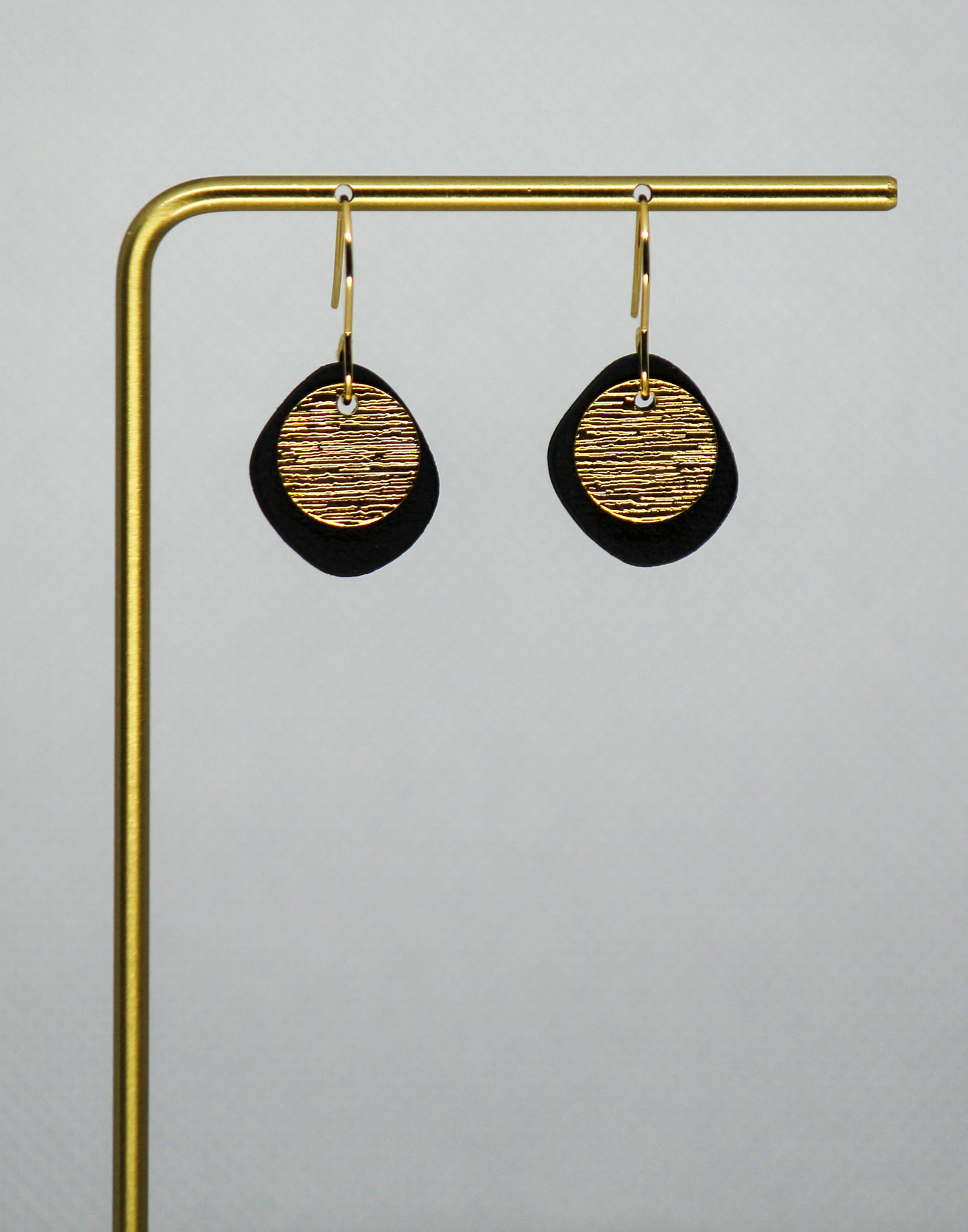 Black Clay With Gold Circle